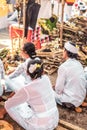 Balinese people praying on a traditional ceremony. Bali island.