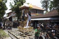 Balinese people preparing for the ceremony of cremation, building the throne tower outside in the street, Bali Island, Indonesia