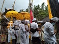 balinese people in the temple ready for ngebejian ceremony before starting pray
