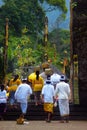 Balinese pilgrim and woman holding offering in Bali-Indonesia