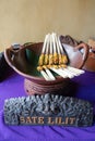 Balinese Sate lilit (Minced chicken Satay) in a serving dish made on a buffet table with a sign