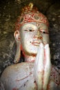 Balinese spiritual wooden buddha statue with praying hands Royalty Free Stock Photo