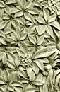 Balinese style stone carving, Plumeria flowers Royalty Free Stock Photo