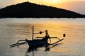 Balinese sunset from the with an anchored fishing boat Royalty Free Stock Photo