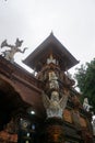 Balinese temple gate entrance statue with plants in Bali Indonesia Royalty Free Stock Photo