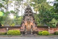 Balinese tradicional gate at Tirta Empul temple with a sunflare in the background, Bali - Indonesia
