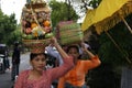 Balinese Woman Carrying Offerings On Her Head