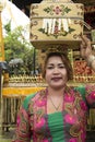 Balinese woman bringing offerings to temple