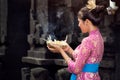 Balinese woman with gods offerings