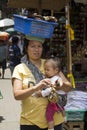 Balinese woman and kid selling souvenirs