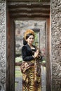 Balinese woman wearing traditional dress with welcome gesture Royalty Free Stock Photo