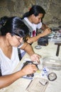 Balinese woman worker making silver jewellery in a traditional method in a Assamese jewellery manufacturing unit