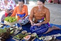 Balinese women preparing Traditional Hindu offering decoration in Bali Indonesia