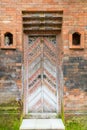 Balinese wood carved doors with traditional local ornaments Royalty Free Stock Photo