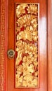 Balinese wood carved doors with traditional local ornaments. Local traditions and craftmanship concept Royalty Free Stock Photo