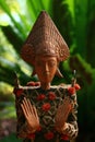 Balinese Wood & Old Asian Coin Statue Royalty Free Stock Photo