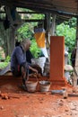 Balinese worker constructing decorative element in Bali Royalty Free Stock Photo