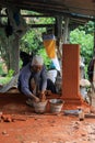 Balinese worker constructing decorative element Royalty Free Stock Photo