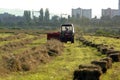 Baling hay in field Royalty Free Stock Photo