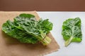 Balkan cuisine. Blitva  chard leaves  - popular leafy vegetables on white table Royalty Free Stock Photo