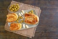 Balkan cuisine. Bureks filled pastry , olives and local white cheese on plate. Copy space