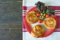 Balkan cuisine. Bureks - popular national dish - on red plate. Flat lay, free space for text