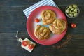 Balkan cuisine. Bureks - popular national dish - on red plate. Flat lay. Free space for text