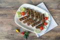 Balkan cuisine. Cevapi - grilled dish of minced meat. Flat lay, free space for text Royalty Free Stock Photo