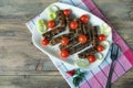 Balkan cuisine. Cevapi - grilled dish of minced meat - on white plate. Flat lay, free space for text Royalty Free Stock Photo