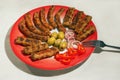 Balkan cuisine. Cevapi and kobasica - grilled dish of minced meat Royalty Free Stock Photo