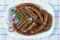 Balkan cuisine. Cevapi, kobasica and pljeskavica - grilled dish of minced meat. Flat lay Royalty Free Stock Photo