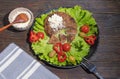 Balkan cuisine. Pljeskavica, kajmak and fresh vegetables Royalty Free Stock Photo