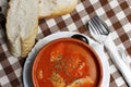 Balkan stew with sausage in a bowl with bread