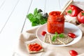 Balkan traditional dish ajvar, lutenitza, pingjur, with bread on a plate on white wooden table. Serbian traditional food Royalty Free Stock Photo