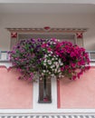 A balkony, decorated with flowers