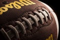 American football Wilson ball on dark background