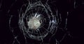 Ball of Baseball breaking Pane of Glass against Black Background