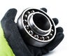 Ball bearing and gloves isolated on white background.Copy space