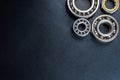 Ball bearing lying on a black background, flat view from above. Royalty Free Stock Photo