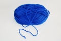 Ball of blue yarn, on white background. Royalty Free Stock Photo