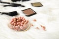 Ball blush and decorative cosmetics on a white background
