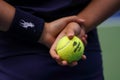 Ball boy holds US Open Wilson tennis ball at Billie Jean King National Tennis Center in New York