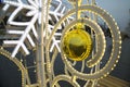 Ball Christmas gold color suspended on the decoration snowflakes electric spiral on the street. Toys, New year