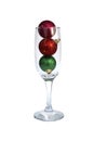Christmas toys in a glass goblet on a white background Royalty Free Stock Photo