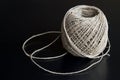A ball of cord made of natural hemp on a black background Royalty Free Stock Photo