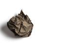 A ball of crumpled brown paper isolated on a light background Royalty Free Stock Photo