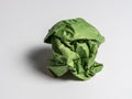 A ball of crumpled green paper on a light background Royalty Free Stock Photo