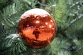 A ball on a decorated christmas tree in the city park, Zvenigorod, Moscow region Royalty Free Stock Photo