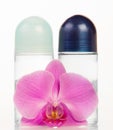 Ball deodorants and orchid flower Royalty Free Stock Photo
