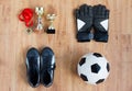 Ball, football boots, gloves, cups and medal Royalty Free Stock Photo
